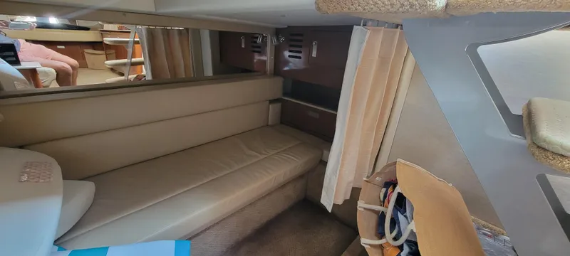 Slide: The Image of Interior cabin of a 2008 Sea Ray 350 Sundancer yacht with beige seating. - 26