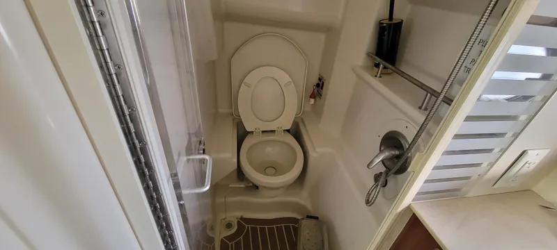 Slide: The Image of 2008 Sea Ray 350 Sundancer bathroom with toilet and shower. - 28
