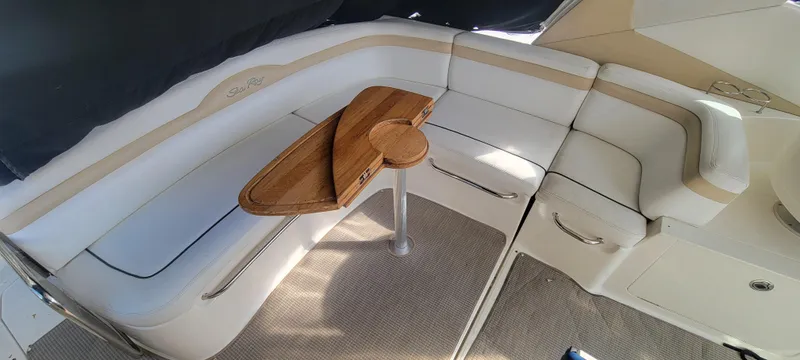 Slide: The Image of Interior seating area of a 2008 Sea Ray 350 Sundancer with a wooden table. - 5