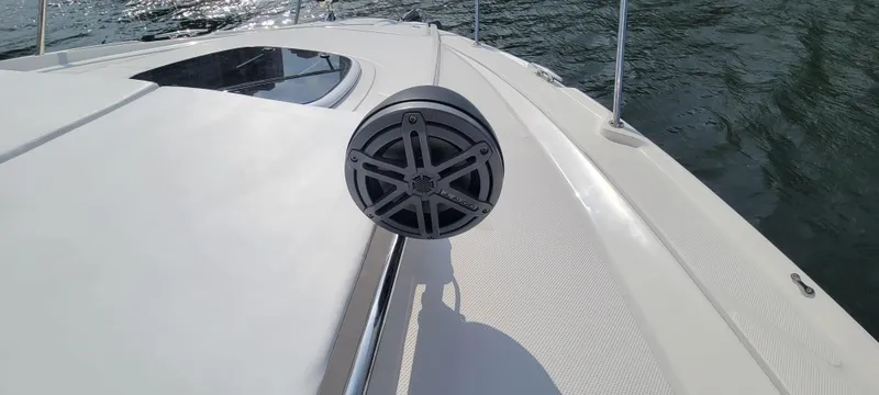 Slide: The Image of 2008 Sea Ray 350 Sundancer boat deck with speaker, on water. - 7