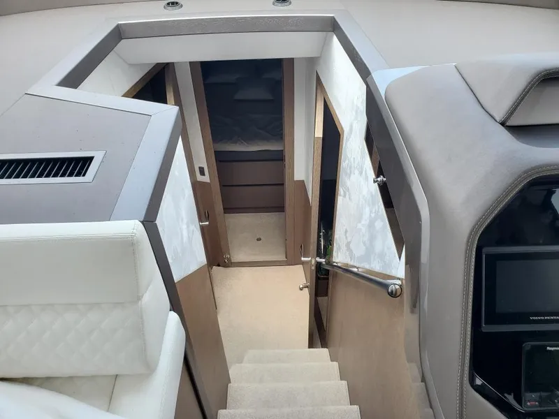 Slide: The Image of Interior cabin of 2020 Galeon 500 Fly yacht with stairs and seating. - 10