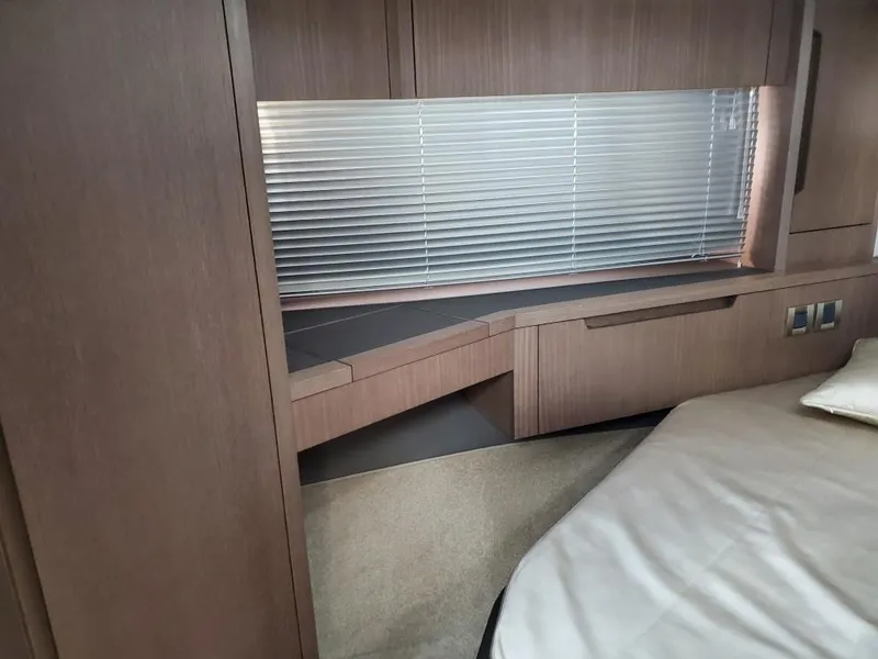 Slide: The Image of Interior cabin of 2020 Galeon 500 Fly yacht with wooden furnishings and blinds. - 12