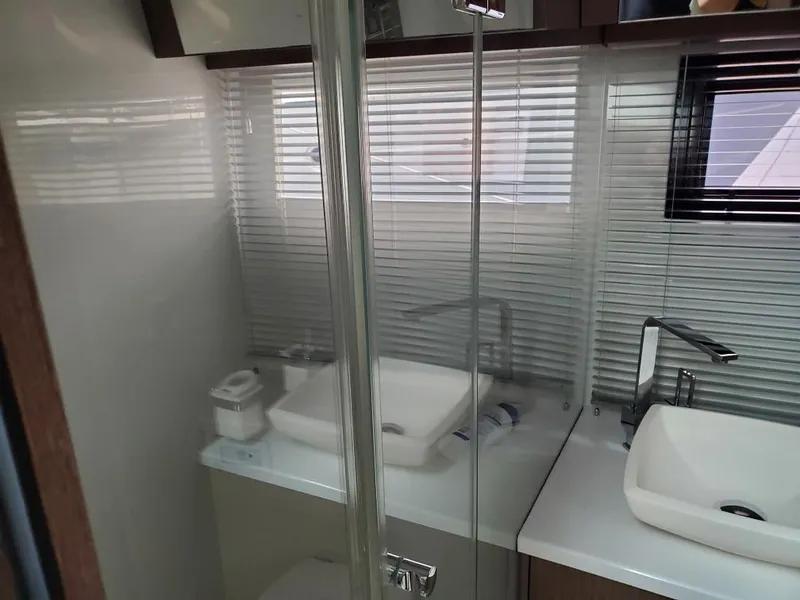 Slide: The Image of Modern bathroom in 2020 Galeon 500 Fly yacht with dual sinks and glass shower. - 14