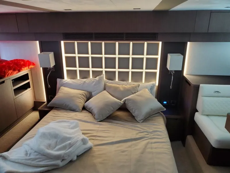 Slide: The Image of Luxurious bedroom in 2020 Galeon 500 Fly yacht with modern lighting and cozy bedding. - 17