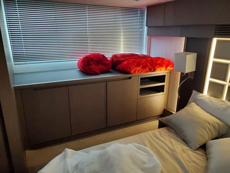 Slide: The Image of Modern bedroom interior of 2020 Galeon 500 Fly yacht with sleek cabinetry and window blinds. - 19