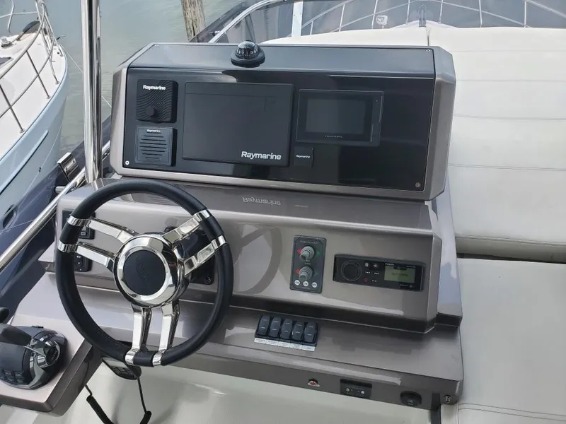 Slide: The Image of 2020 Galeon 500 Fly yacht helm with Raymarine navigation system. - 29