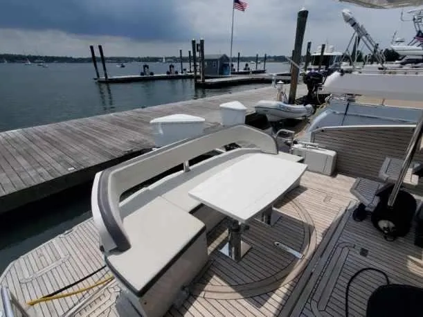 Slide: The Image of Galeon 500 Fly 2020 yacht docked, featuring a stylish outdoor seating area. - 3