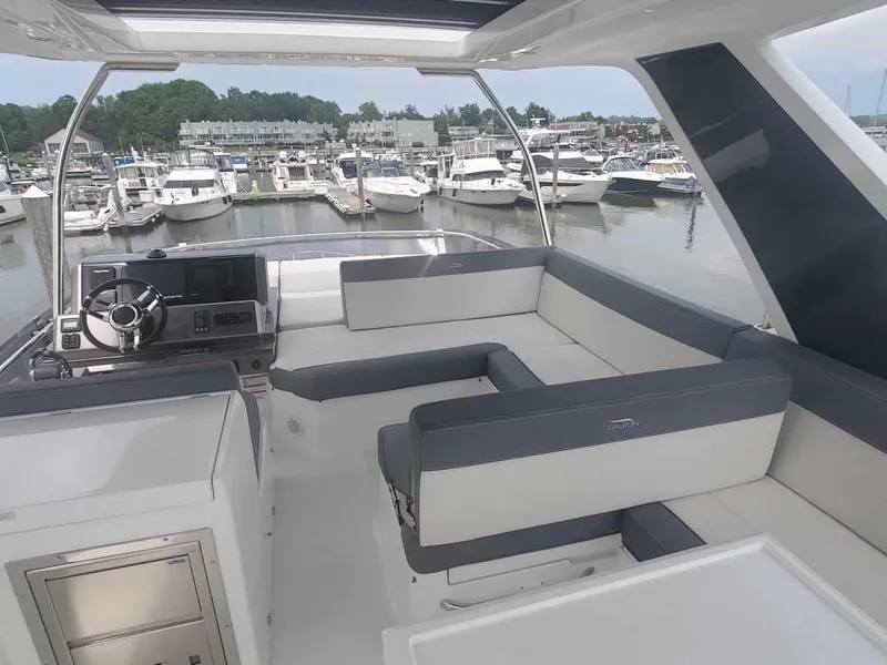 Slide: The Image of Flybridge of 2020 Galeon 500 Fly yacht with marina view. - 31