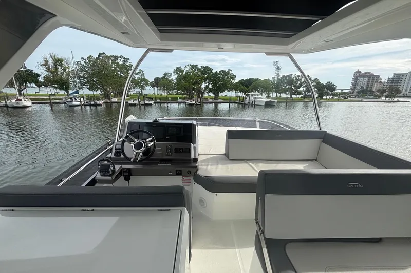 Slide: The Image of Interior view of 2020 Galeon 500 Fly yacht with helm and seating area. - 36
