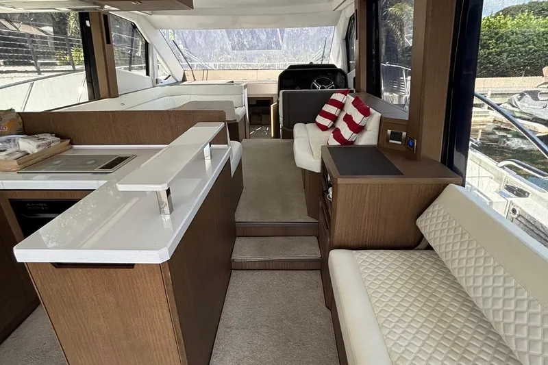 Slide: The Image of Luxurious interior of 2020 Galeon 500 Fly yacht with modern seating and kitchen area. - 38
