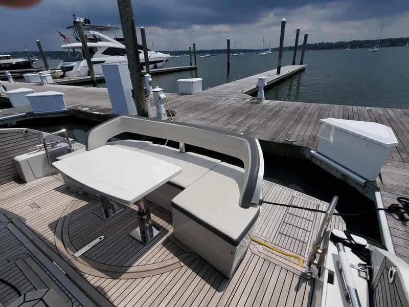 Slide: The Image of Galeon 500 Fly 2020 yacht at dock with seating and table on deck. - 4