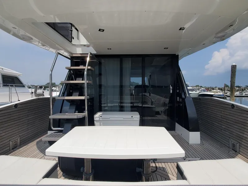 Slide: The Image of Galeon 500 Fly 2020 yacht with outdoor seating and staircase to upper deck. - 5
