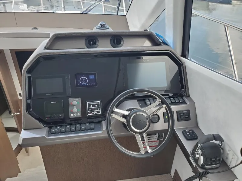 Slide: The Image of Helm station of 2020 Galeon 500 Fly yacht with modern navigation equipment. - 9
