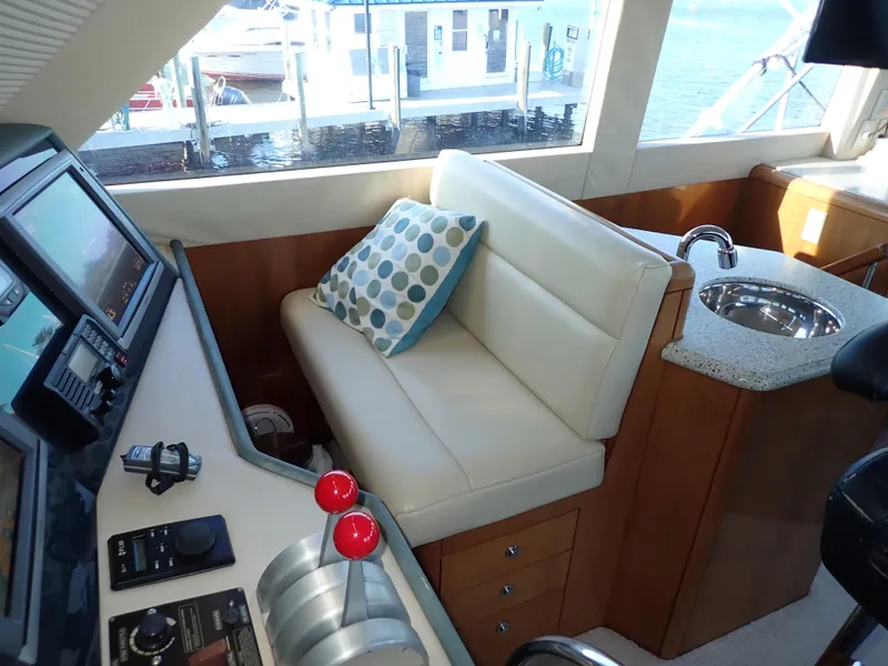 Slide: The Image of Hatteras 60 SOMETHING FISHY - Enclosed Flybridge Helm Station - 24