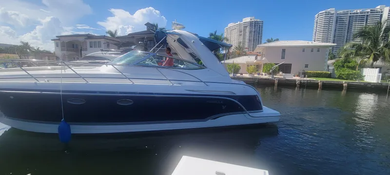 Slide: The Image of 2006 Formula 34 PC yacht docked in sunny waterfront setting. - 15