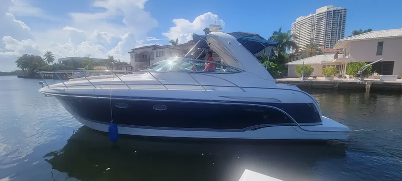 Slide: The Image of 2006 Formula 34 PC yacht docked in sunny waterfront setting. - 16