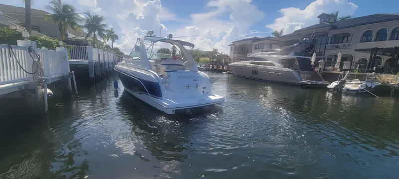 Slide: The Image of 2006 Formula 34 PC yacht docked in sunny marina with luxury boats. - 17