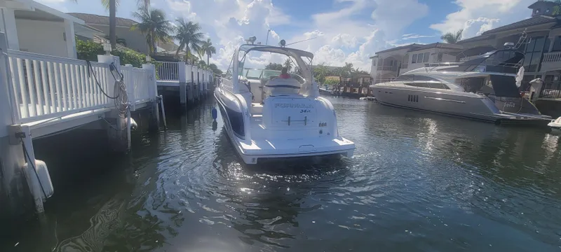 Slide: The Image of 2006 Formula 34 PC boat docked in a sunny marina. - 18