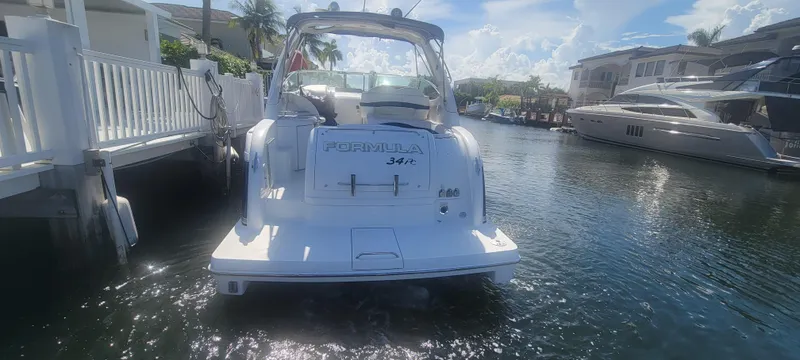 Slide: The Image of 2006 Formula 34 PC boat docked in sunny marina. - 19