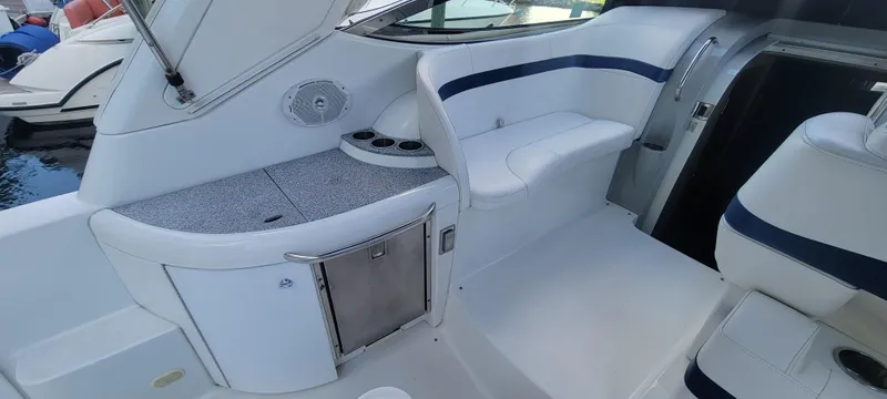 Slide: The Image of 2006 Formula 34 PC boat interior with seating and storage compartments. - 22