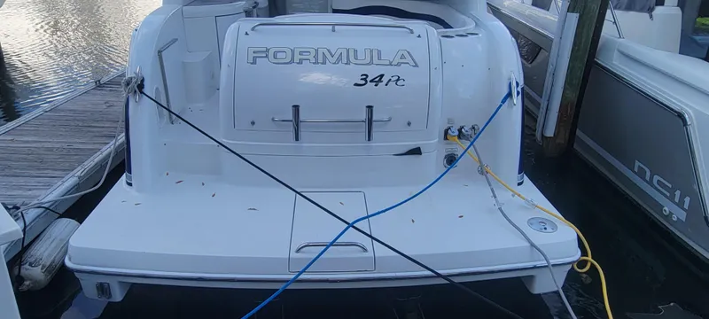 Slide: The Image of 2006 Formula 34 PC boat docked at marina. - 29