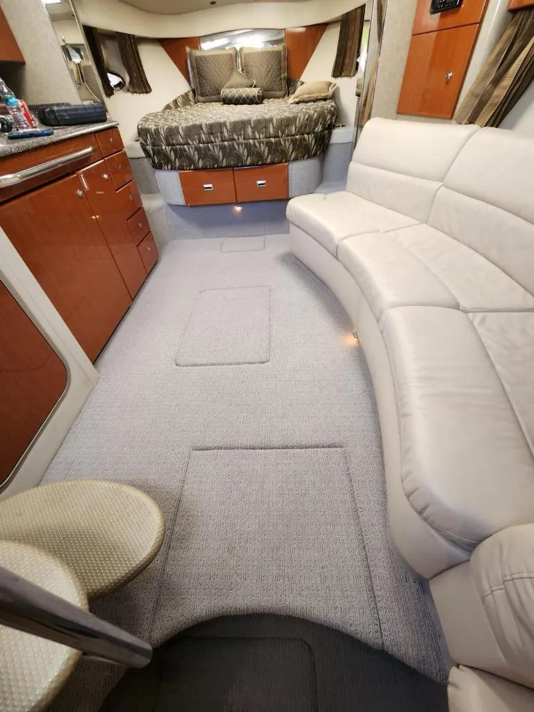 Slide: The Image of Interior of a 2006 Formula 34 PC yacht with a cozy bed and leather seating. - 31