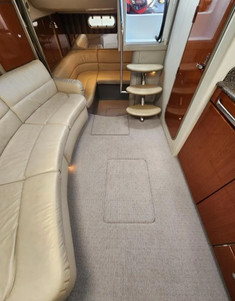 Slide: The Image of 2006 Formula 34 PC yacht interior with beige leather seating and wooden cabinetry. - 32