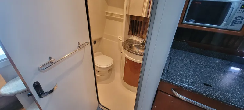 Slide: The Image of 2006 Formula 34 PC boat interior bathroom and kitchenette. - 39