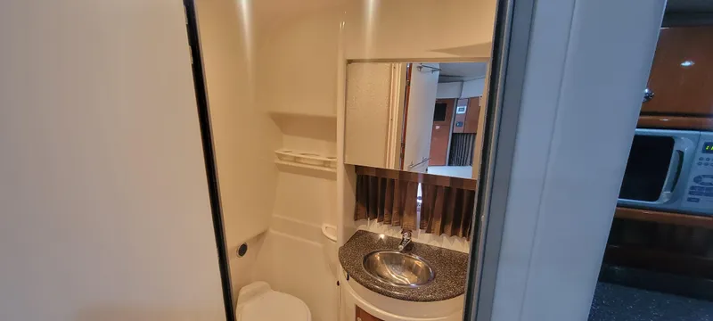 Slide: The Image of 2006 Formula 34 PC yacht bathroom with sink, mirror, and toilet. - 41