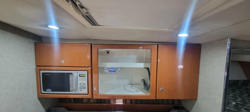 Slide: The Image of Interior of 2006 Formula 34 PC yacht with microwave and storage cabinets. - 42