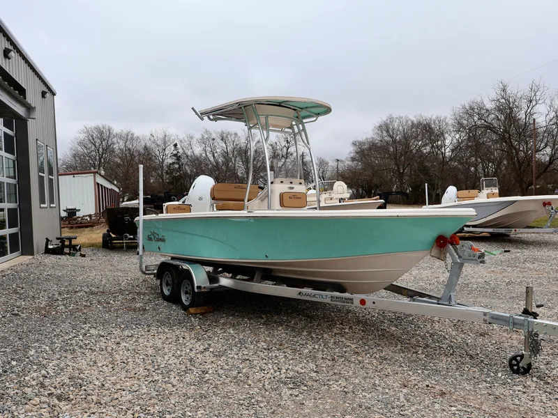 Slide: The Image of 2024 Sea Chaser 21 LX boat on a trailer outside a dealership. - 3