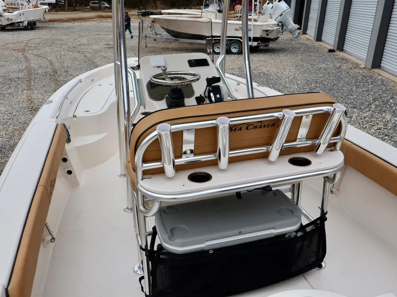 Slide: The Image of 2024 Sea Chaser 21 LX boat interior with rod holders and storage. - 6