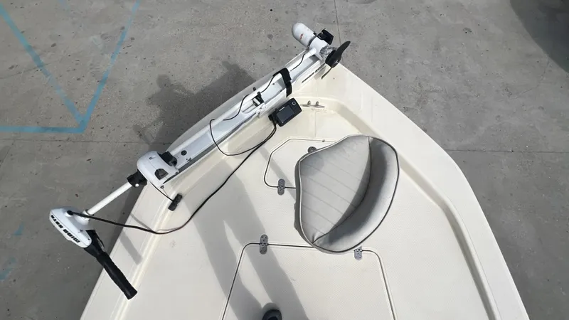 Slide: The Image of Frontier 2104 boat, 2012 model, with mounted trolling motor and swivel seat. - 10