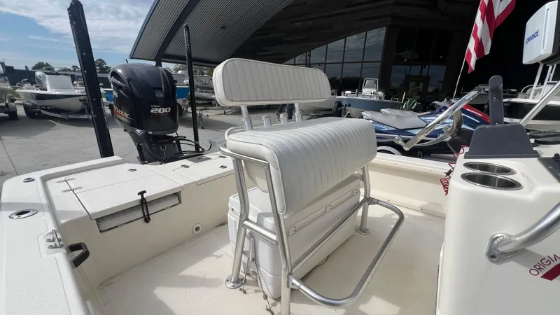 Slide: The Image of 2012 Frontier 2104 boat with seating and 200 HP outboard motor. - 12