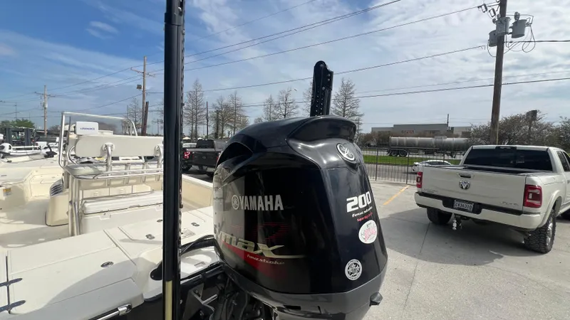 Slide: The Image of Yamaha 200 HP outboard motor on a 2012 Frontier 2104 boat. - 14
