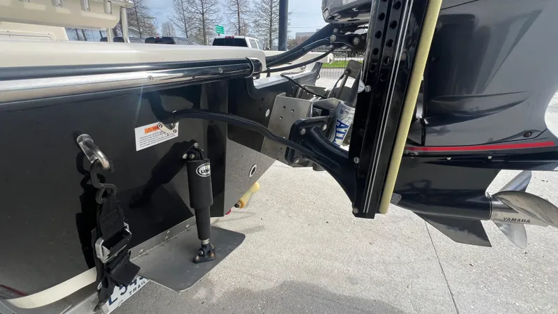 Slide: The Image of Close-up of a 2012 Frontier 2104 boat's outboard motor and mounting bracket. - 15