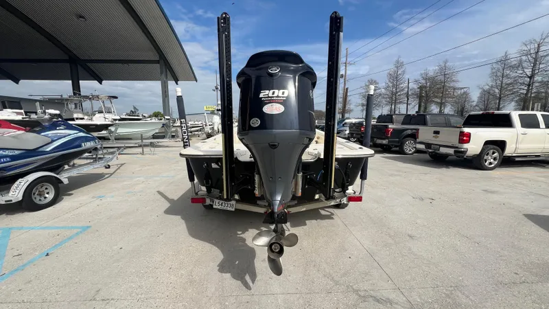 Slide: The Image of Rear view of a 2012 Frontier 2104 boat with a 200 HP outboard motor. - 4
