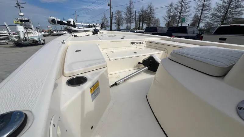 Slide: The Image of 2012 Frontier 2104 boat interior with seating and storage compartments. - 9