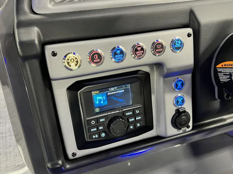 Slide: The Image of Control panel of 2024 Berkshire 25ULE Roswell Arch STS Tritoon with illuminated buttons and display. - 11