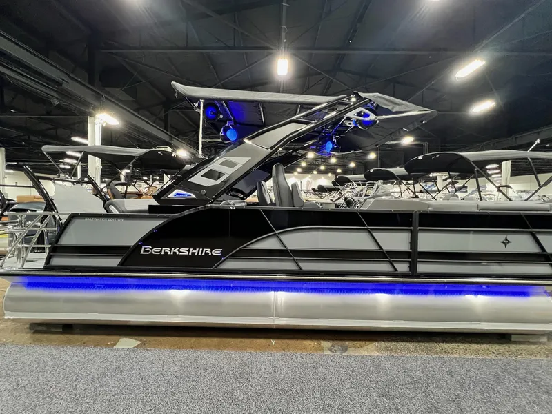 Slide: The Image of 2024 Berkshire 25ULE Roswell Arch STS Tritoon with sleek design and blue LED lighting. - 14