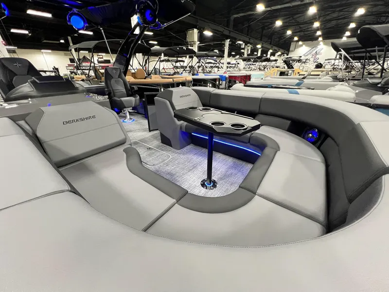 Slide: The Image of 2024 Berkshire 25ULE Roswell Arch STS Tritoon interior with luxurious seating and modern design. - 20