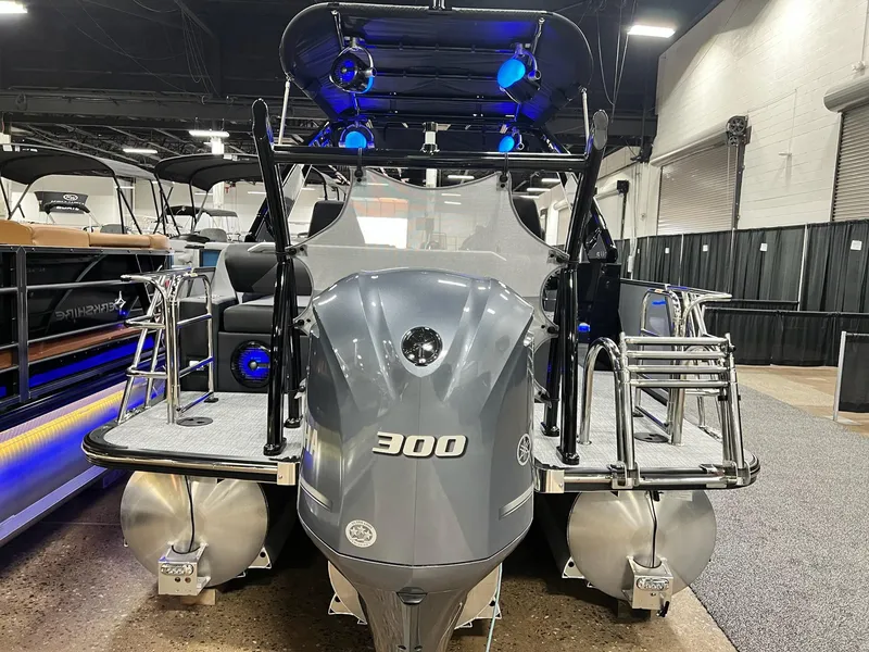 Slide: The Image of 2024 Berkshire 25ULE Roswell Arch STS Tritoon with Yamaha 300 engine displayed indoors. - 22