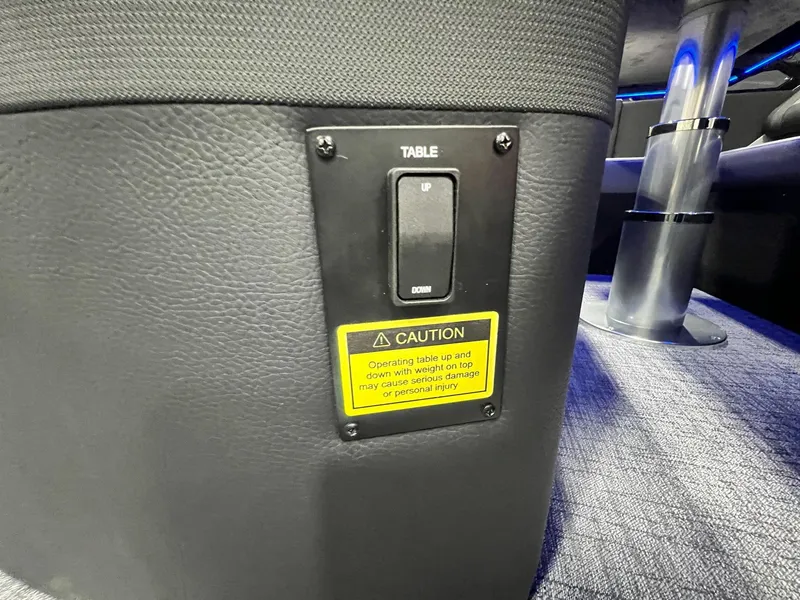 Slide: The Image of 2024 Berkshire 25ULE Roswell Arch STS Tritoon table control switch with caution label. - 27