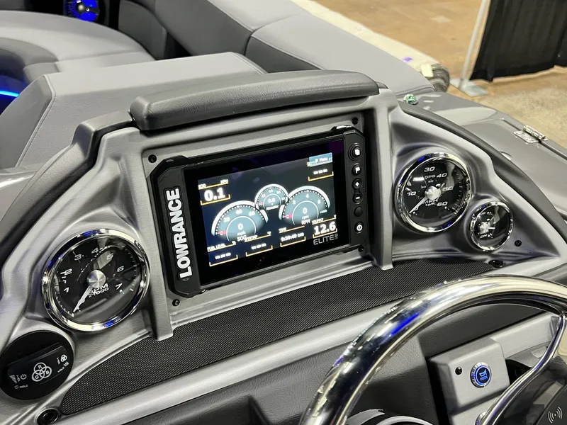 Slide: The Image of 2024 Berkshire 25ULE Roswell Arch STS Tritoon dashboard with Lowrance Elite display and gauges. - 29