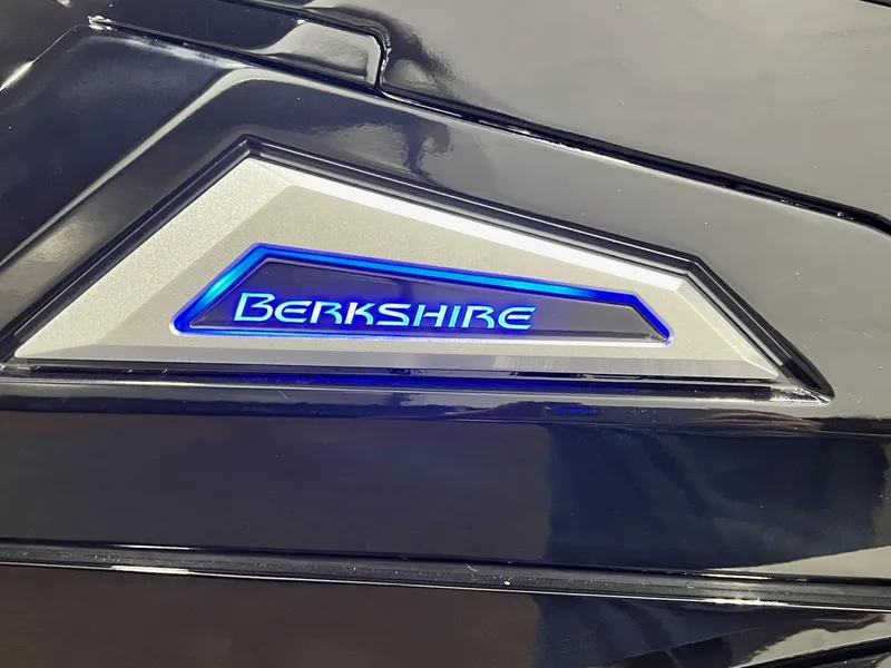 Slide: The Image of Close-up of 2024 Berkshire 25ULE Roswell Arch STS Tritoon logo with blue backlight. - 3