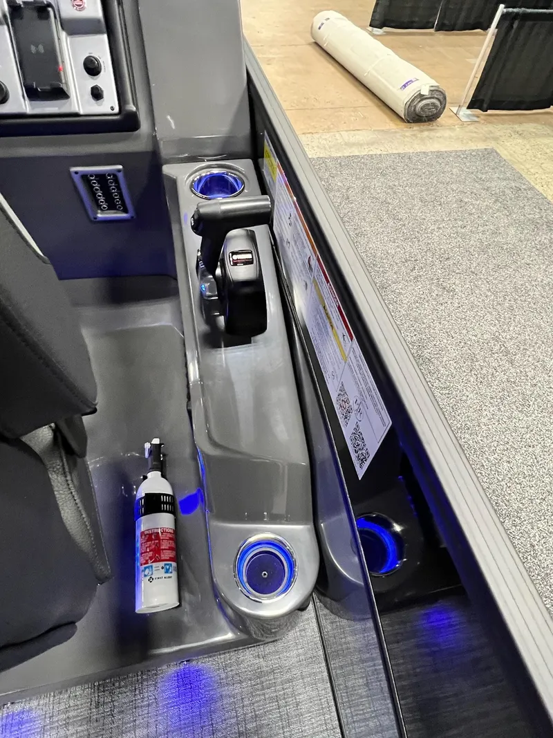 Slide: The Image of 2024 Berkshire 25ULE Roswell Arch STS Tritoon control panel with cup holders and fire extinguisher. - 31
