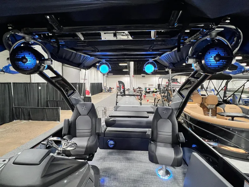 Slide: The Image of 2024 Berkshire 25ULE Roswell Arch STS Tritoon interior with modern seating and blue lighting. - 33