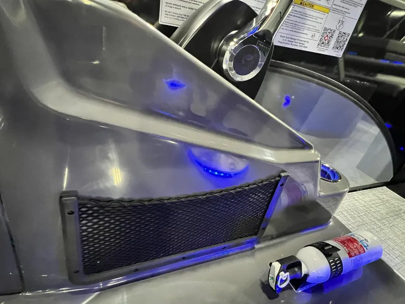 Slide: The Image of 2024 Berkshire 25ULE Roswell Arch STS Tritoon dashboard with blue LED lights and fire extinguisher. - 36