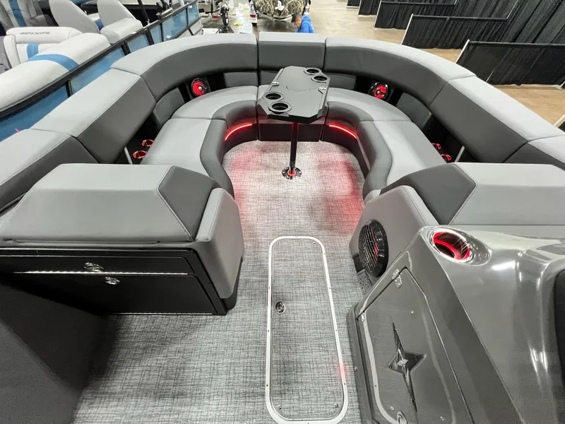 Slide: The Image of Interior of 2024 Berkshire 25ULE Roswell Arch STS Tritoon with gray seating and red LED lighting. - 40