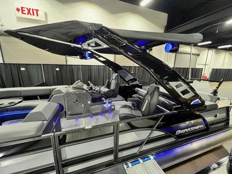 Slide: The Image of 2024 Berkshire 25ULE Roswell Arch STS Tritoon with sleek black design and modern interior. - 43